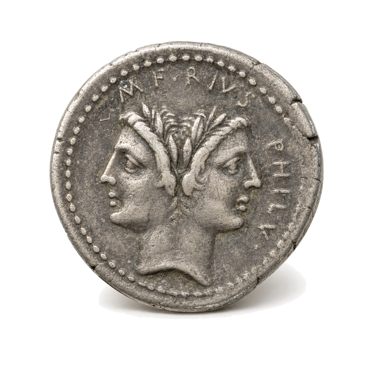 Slightly angled silver Roman denarius with a Janus head and dotted border